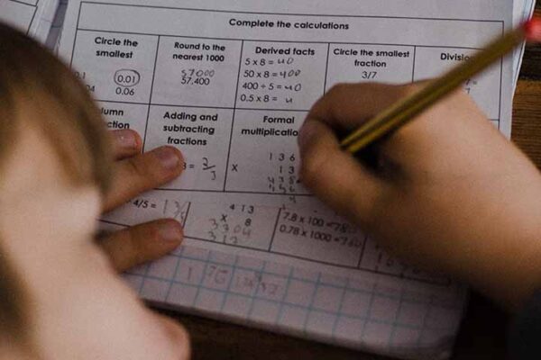 Homeschool boy doing math homework